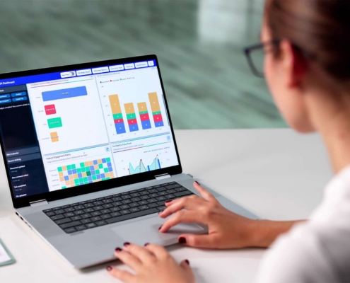 Worker Looking At Marketing Insights On Laptop